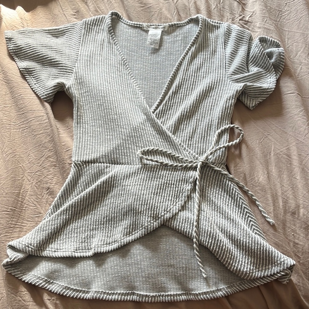 Caution to the wind flattering top